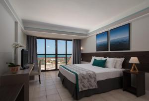 Cama ou camas em um quarto em Wish Natal