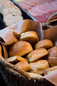 a basket filled with lots of different types of bread at Hotel Casa Higueras in Valparaíso