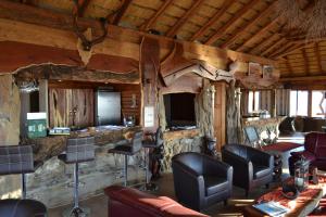 a room with chairs and a barber shop at Namibs Valley Lodge in Gamsberg Pass