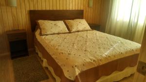 Ένα ή περισσότερα κρεβάτια σε δωμάτιο στο Cabanas Manzanal