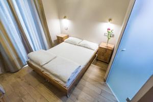 Postel nebo postele na pokoji v ubytování Kaplan Hotel