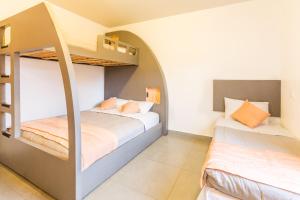 Llit o llits en una habitació de Concept Design Hostel & Suites