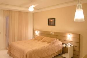 Cama ou camas em um quarto em Marin Château Empreendimentos Turísticos