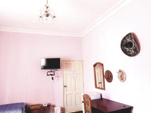 TV o dispositivi per l'intrattenimento presso Travellers Inn