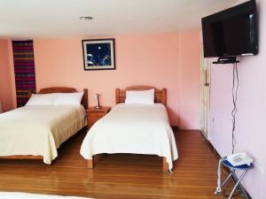 Letto o letti in una camera di Travellers Inn