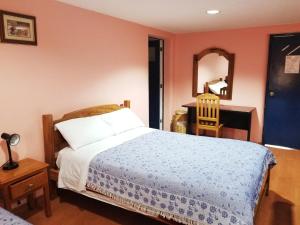 Letto o letti in una camera di Travellers Inn