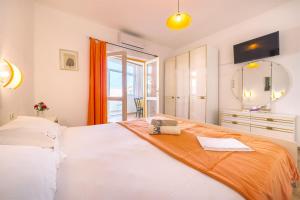 Postel nebo postele na pokoji v ubytování Apartments Zanze