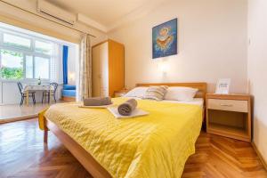 Postel nebo postele na pokoji v ubytování Apartments Zanze