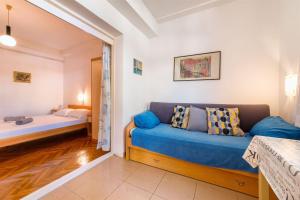 Postel nebo postele na pokoji v ubytování Apartments Zanze