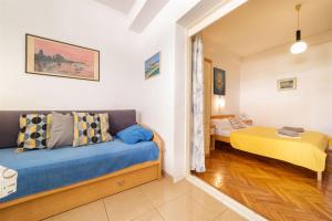 Postel nebo postele na pokoji v ubytování Apartments Zanze