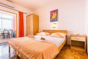 Postel nebo postele na pokoji v ubytování Apartments Zanze