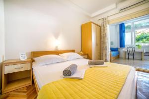 Postel nebo postele na pokoji v ubytování Apartments Zanze