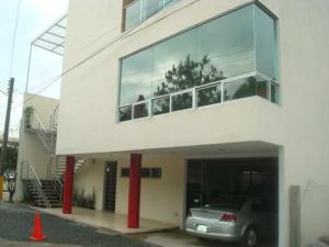 a car parked in front of a building at Hotel Sierra Inn in Xicotepec de Juárez