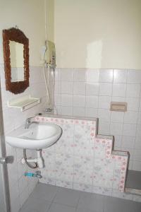 a bathroom with a sink and a mirror at Seaworld Guesthouse in Ao Nang Beach