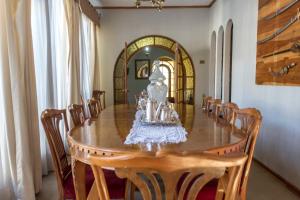 a dining room with a table and chairs at Hotel Boutique Molino Viejo in San Carlos
