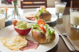 two plates of breakfast food on a table at Shan Bian 52 Homestay in Fengshan