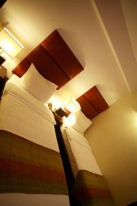 Een bed of bedden in een kamer bij Hotel Metropole