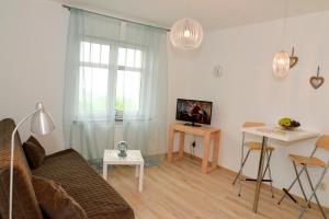 TV a/nebo společenská místnost v ubytování Karpacz Sucha, Sun & Snow