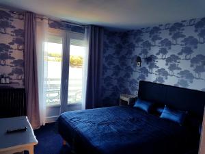 Postel nebo postele na pokoji v ubytování Hotel Restaurant La Caravelle