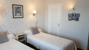 Postel nebo postele na pokoji v ubytování Hotel Restaurant La Caravelle