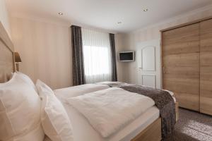Postel nebo postele na pokoji v ubytování Hotel Garni Fürst von Waldeck