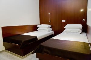 Voodi või voodid majutusasutuse Hotel Olsi toas