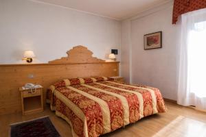 Posteľ alebo postele v izbe v ubytovaní Hotel Al Prato