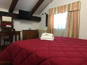 Postel nebo postele na pokoji v ubytování Hotel Biancaneve
