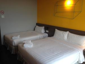 Postel nebo postele na pokoji v ubytování KIP Hotel