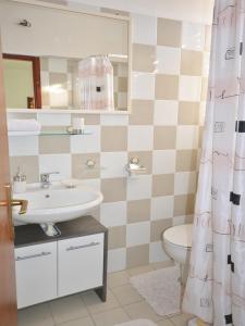 Ванна кімната в Apartments & Rooms Boris