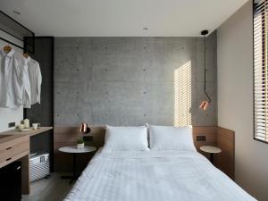 Letto o letti in una camera di Monka Hotel