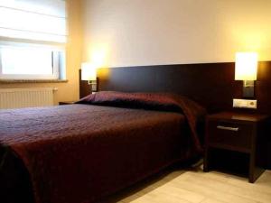 Postel nebo postele na pokoji v ubytování Hotel il Castello Borghese