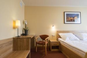 Posteľ alebo postele v izbe v ubytovaní Hotel Gorzów