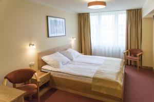 Posteľ alebo postele v izbe v ubytovaní Hotel Gorzów