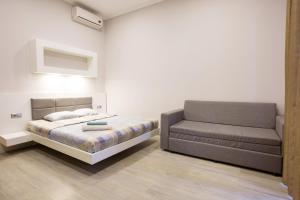 Säng eller sängar i ett rum på Pushkinskaya Apartments