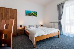 Ένα ή περισσότερα κρεβάτια σε δωμάτιο στο Villa Cicho Sza