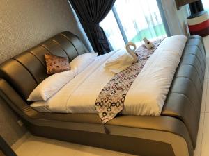 Postel nebo postele na pokoji v ubytování ATS Cameron Hotel & Apartments