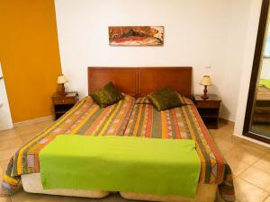 A bed or beds in a room at Porto Mos Residence