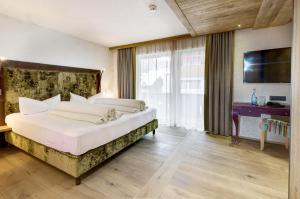 Voodi või voodid majutusasutuse Hotel Rose toas