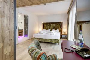 Voodi või voodid majutusasutuse Hotel Rose toas