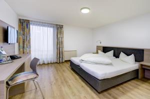 Voodi või voodid majutusasutuse Hotel Rose toas