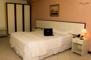 Postel nebo postele na pokoji v ubytování Crystal Apart Hotel
