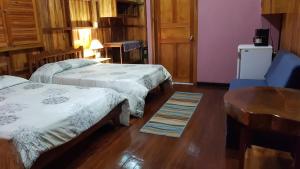 Voodi või voodid majutusasutuse Ciudad Perdida EcoLodge toas