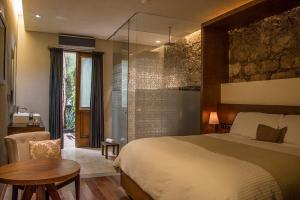 Tempat tidur dalam kamar di Hotel Boutique Casa Madero