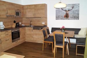 Köök või kööginurk majutusasutuses Sieglhub Chalets - Appartements - Hotel