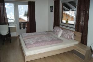 Ein Bett oder Betten in einem Zimmer der Unterkunft Schiestlhof