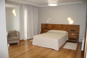 Łóżko lub łóżka w pokoju w obiekcie Hotel - Restaurante Casa Rosita