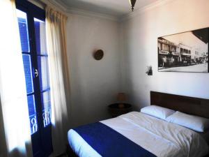 Postel nebo postele na pokoji v ubytování Hôtel Central
