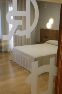 Łóżko lub łóżka w pokoju w obiekcie Hotel - Restaurante Casa Rosita