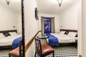 Postel nebo postele na pokoji v ubytování Hôtel Central